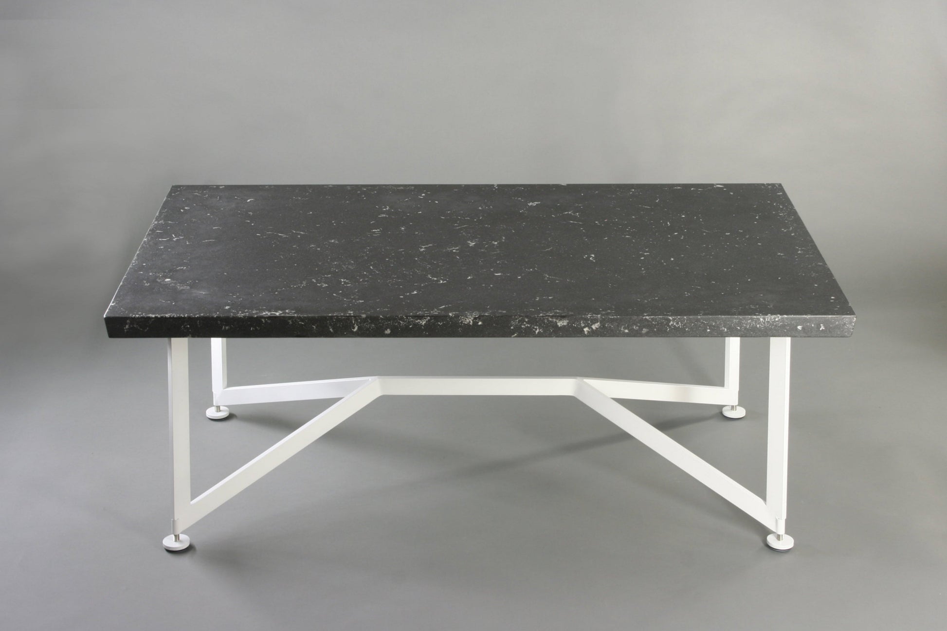 Bevel Coffee Table - Black top/White legs, side view